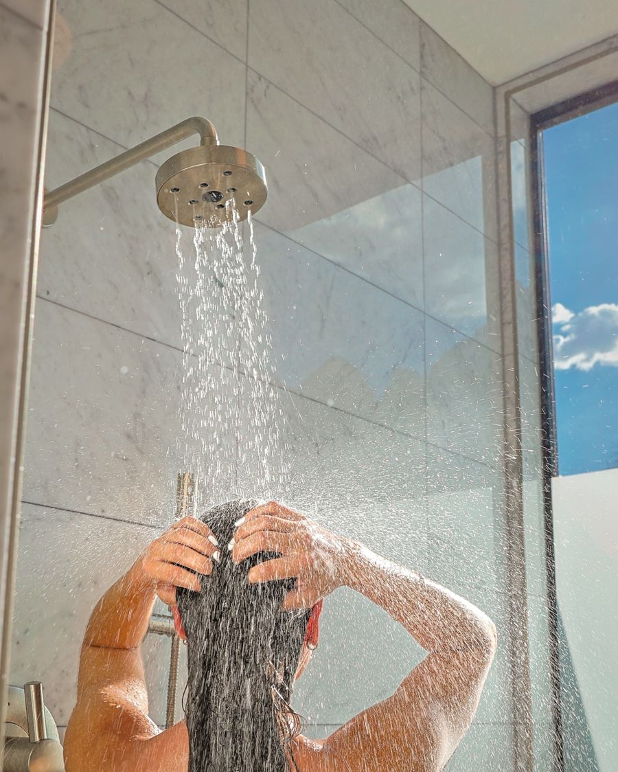 Lifestyle content of a guest showering, talent-led hospitality campaign