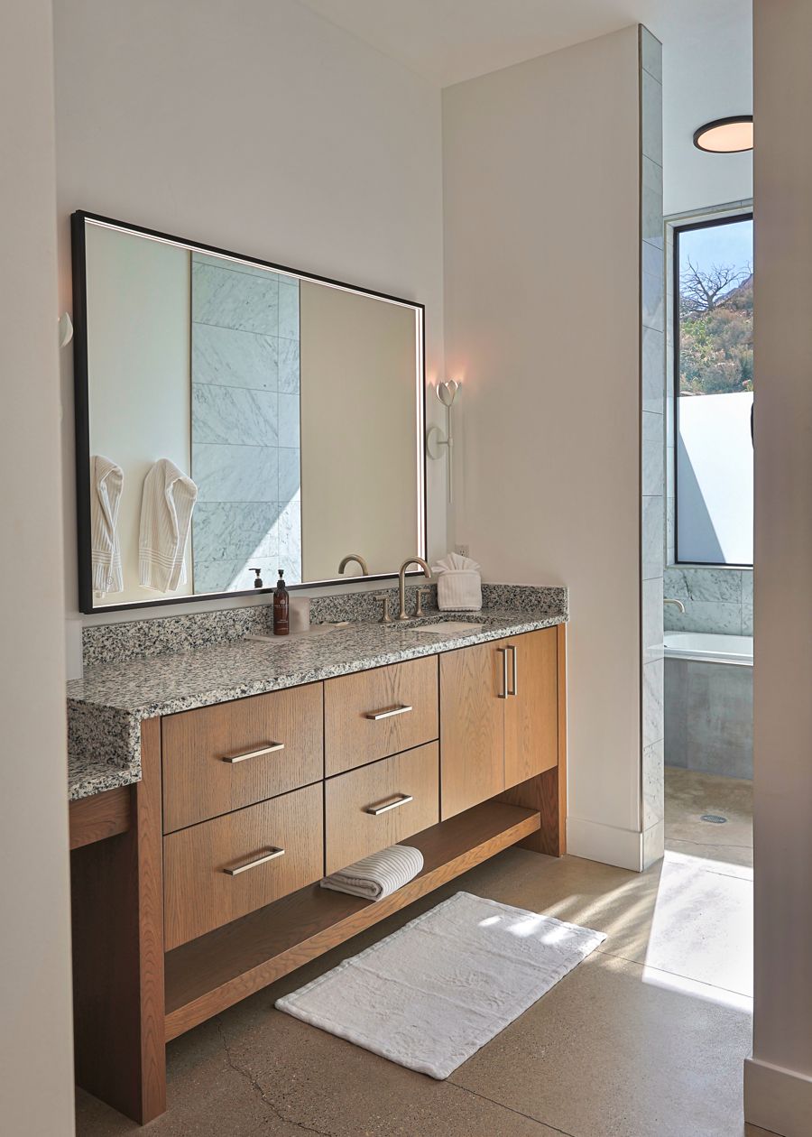 Bathroom vanity detail with granite counter and modern fixtures